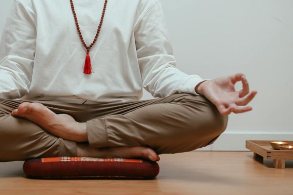 Close-up of a person's hands in a graceful yoga mudra.